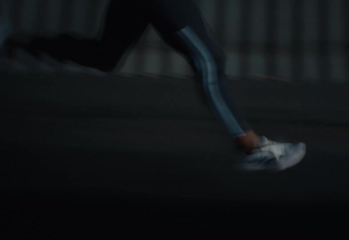 A woman runs on the road sped up