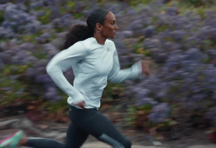A runner sprinting along a road