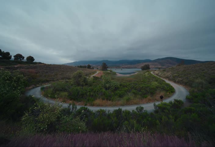A woman runs around a path outdoors