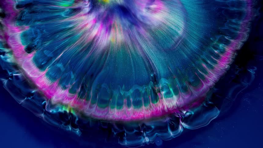 a half circle of vibrant colors and glitter spreads in perfect shape like a surreal space scenery