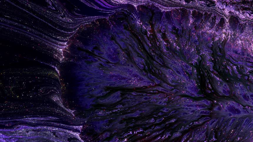 Outer space liquid art with glistering paint on dark background