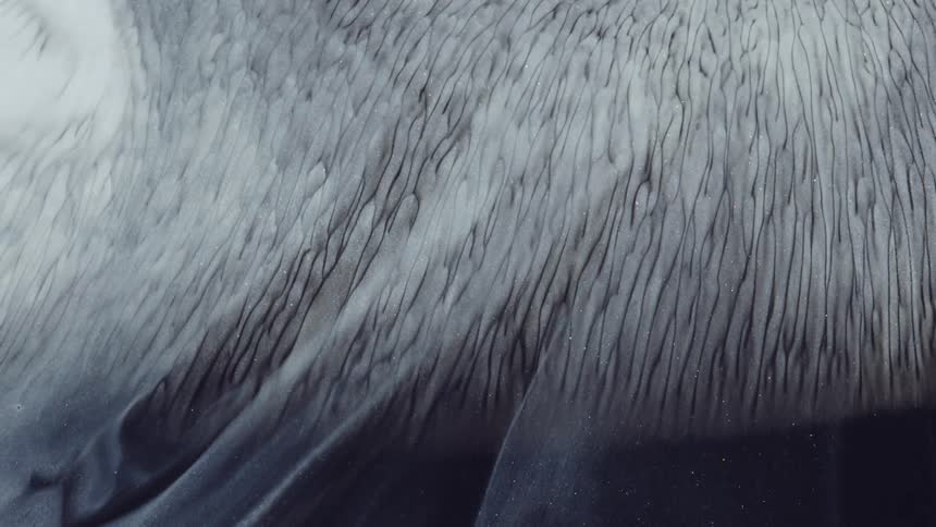 Special and abstract effects of a layer of white shiny smoke in motion