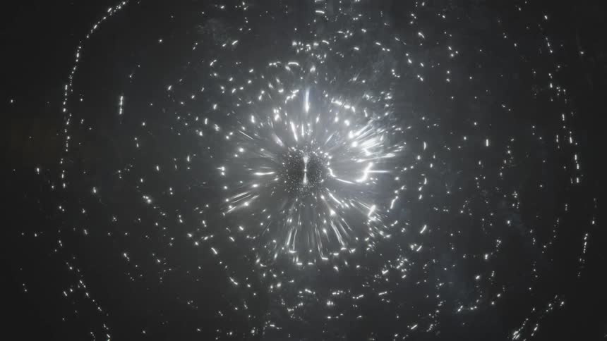 Abstract light ornament expanding and dissipating in a dense liquid