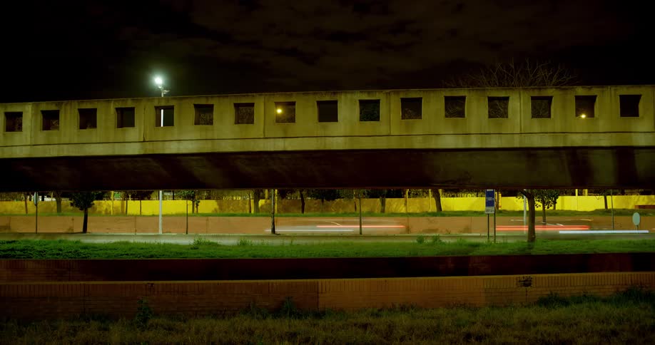 View of a bridge and road with vehicles moving in time lapse