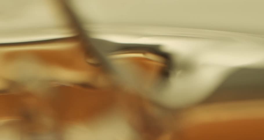 A wave of golden yellow thick honey
