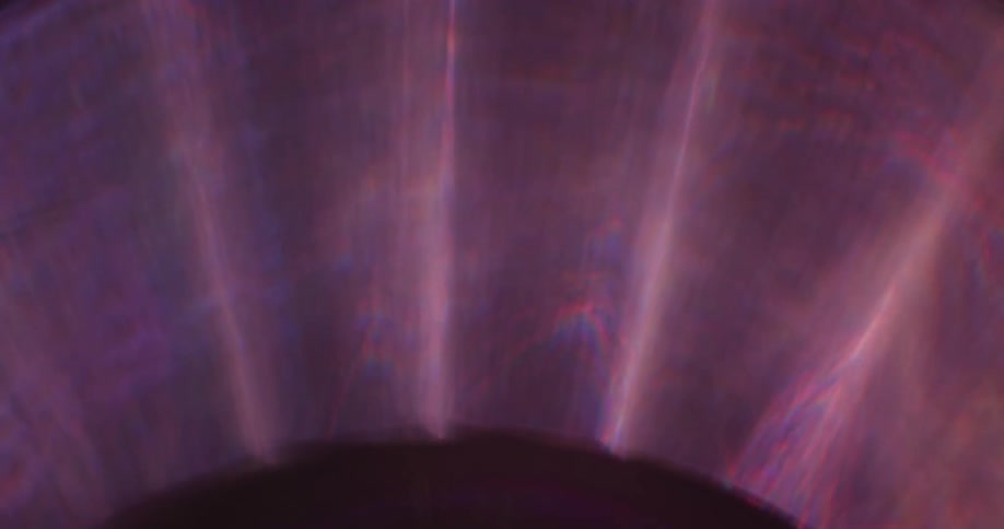 Reflection of light flares against a black background