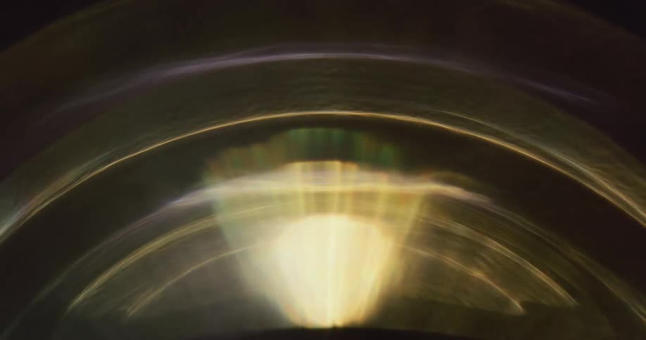 Black background with round spiral light reflections