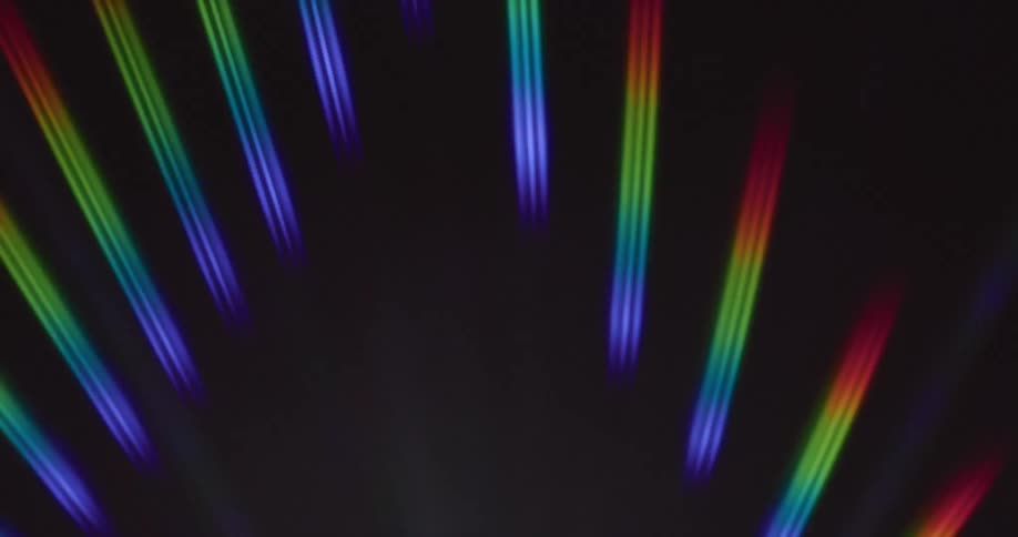 Several beams of light of the same color moving to the front