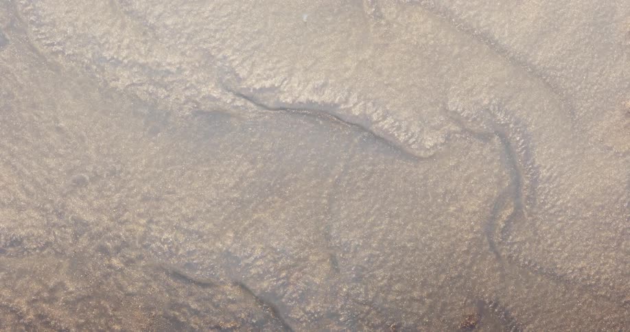Abstract moving sand with liquid