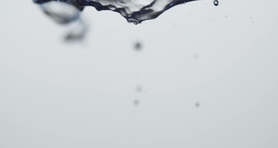 Several bubbles of a clear fluid rising upwards