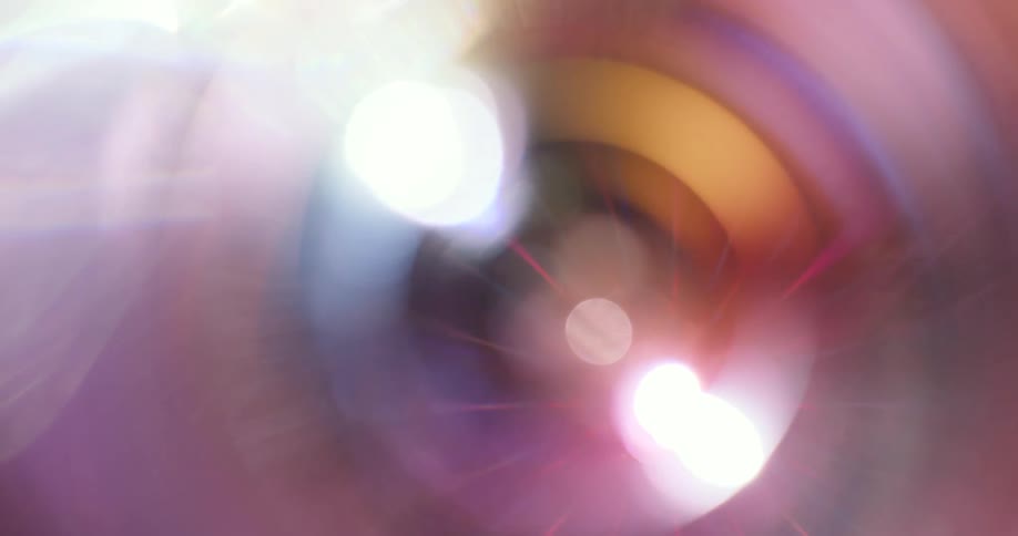 A wheel with pink tones moves and shines glaring light