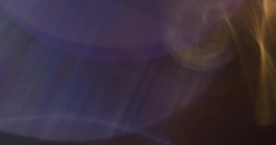 Light rays form display of shapes against a dark background