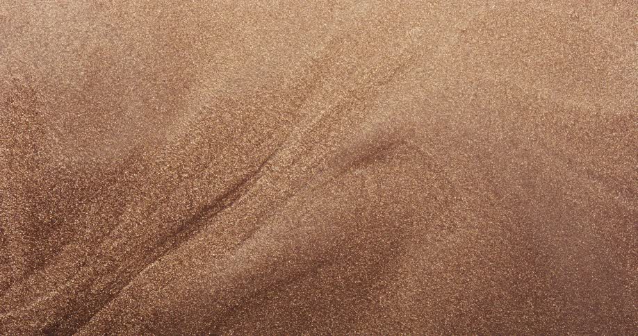 Abstract golden sand in slow motion