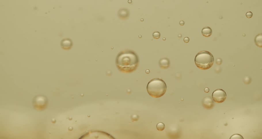 A flowing brown oily bobbles