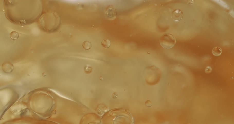 The gold liquid mixes around