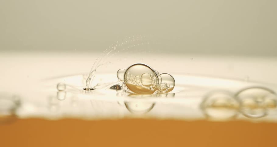 Air bubble on the surface of honey breaks