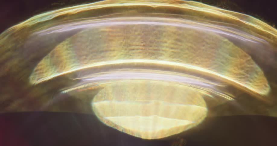 Reflection of light flares against a black background