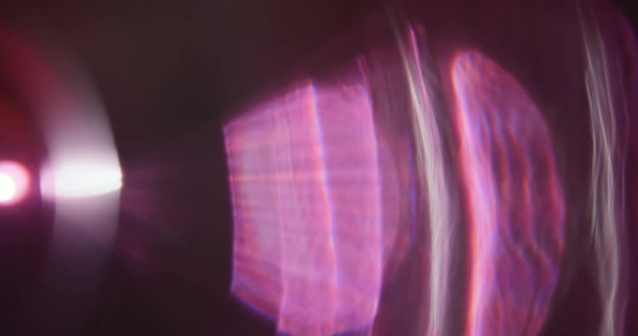 Reflection of light flares against a black background