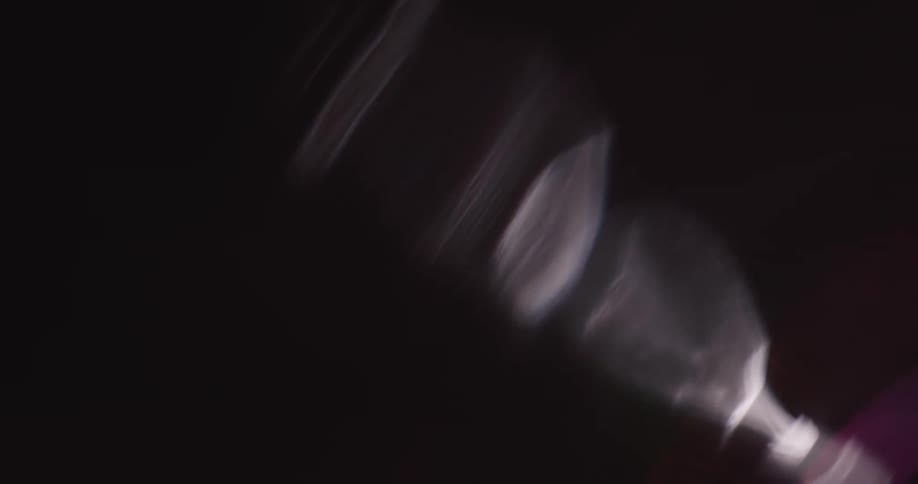 Reflection of light flares against a black background