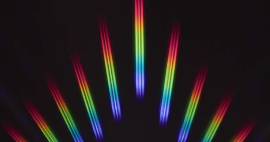 Lines of rainbow colored lights light up and fan out