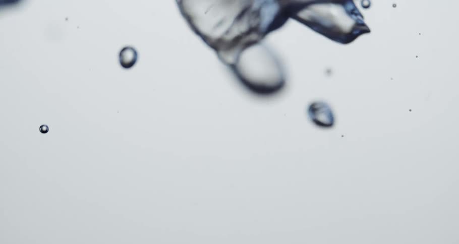 Abstract water bubbles rising in slow motion
