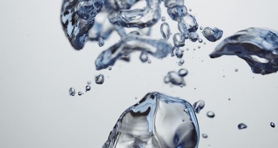 Rippling air bubbles rise on clear water