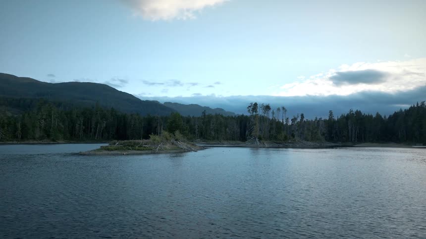 Aerial view of an island on a lake in the mountains