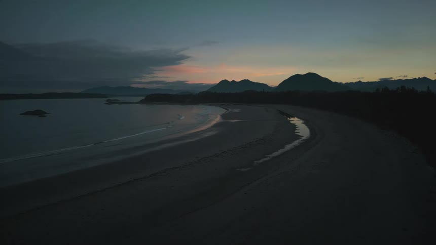 Aerial view of the shore of a lake at evening