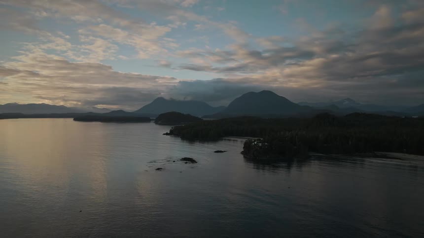 Aerial view of a lake in the mountains at evening