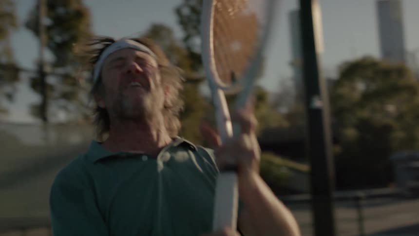 Portrait of a man playing tennis and getting frustrated