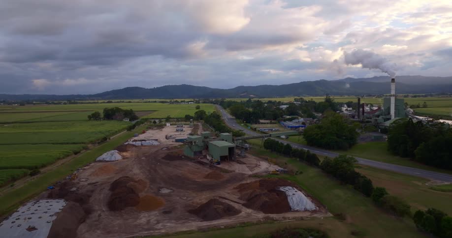 Aerial view of a factory in the countryside at sunset