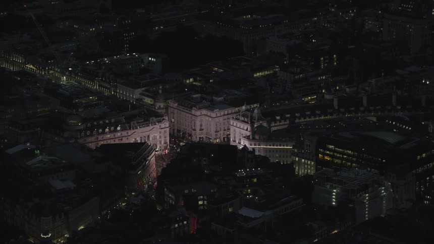 The roads are full of cars in the city at night