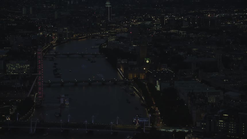 Aerial view of bridges over river thames and illuminated buildings at night
