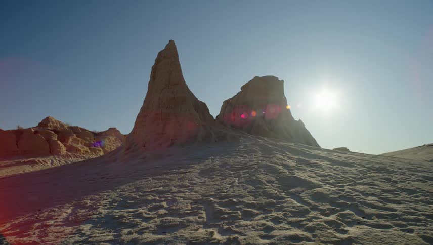 Desert with geological rocks and sunlight