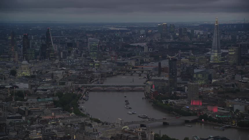 Aerial view of buildings and bridges over river thames in the city