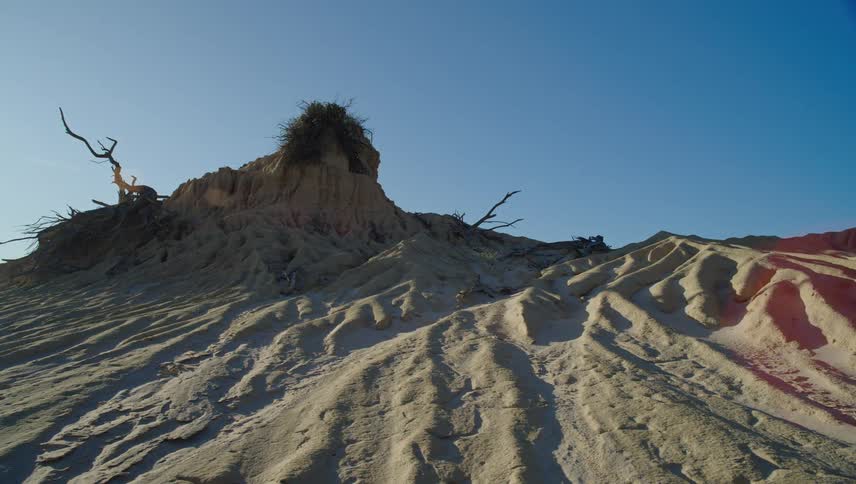 Sand dune against the blue sky in the desert