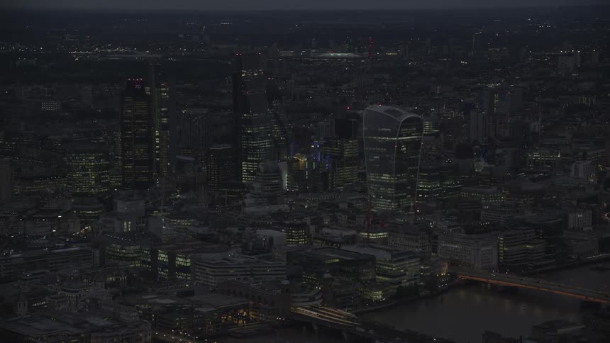 Aerial of illuminated skyscrapers and buildings in the city