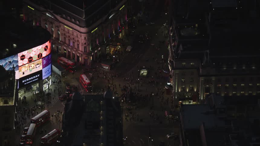 Aerial view of illuminated buildings in the downtown area at night