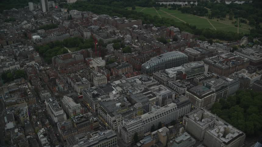 A large city is shown from above with several buildings and structures