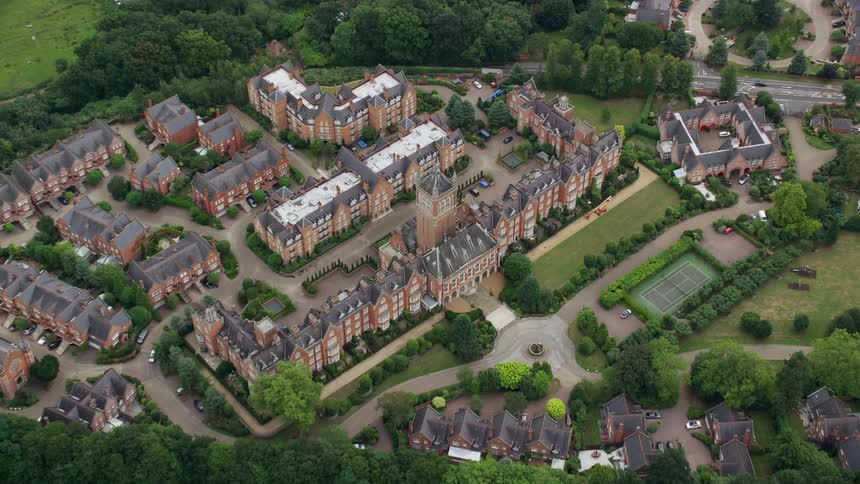 Housing complexes border woods near countryside