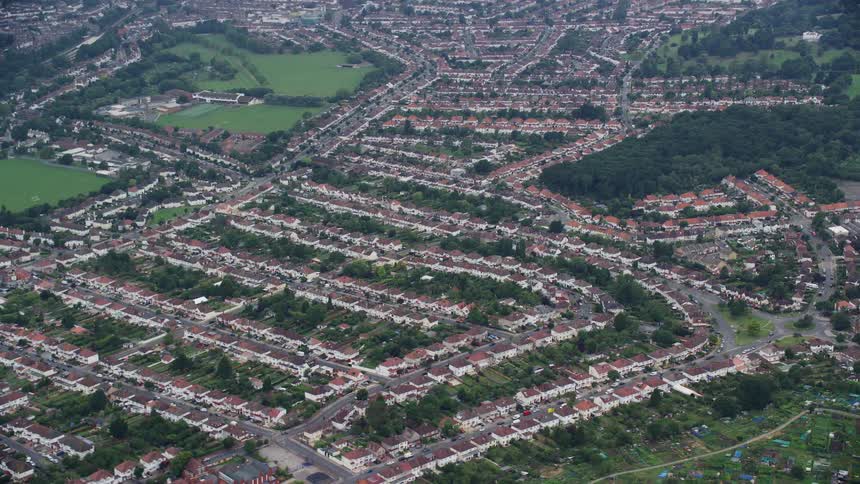 A huge suburban neighborhood in a city with lots of streets and greenery