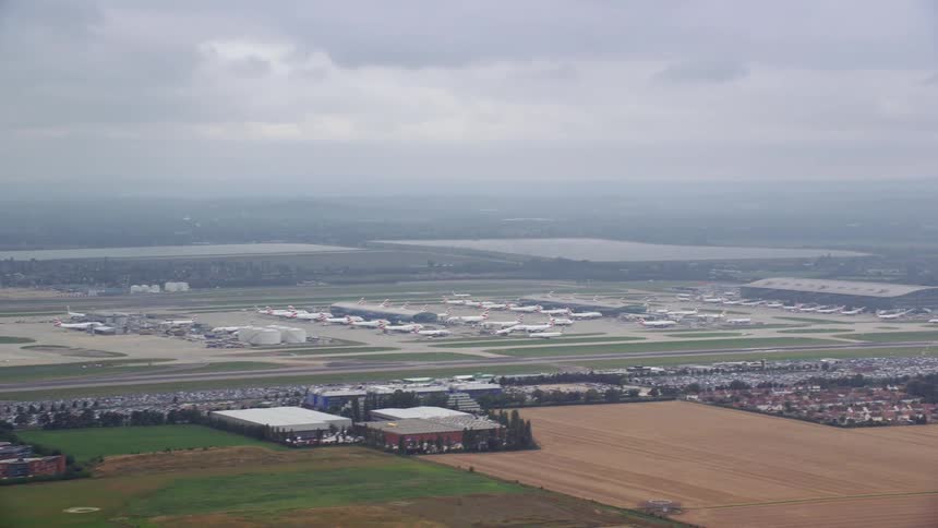 Aerial view of an airplane taking off a runway in the airport