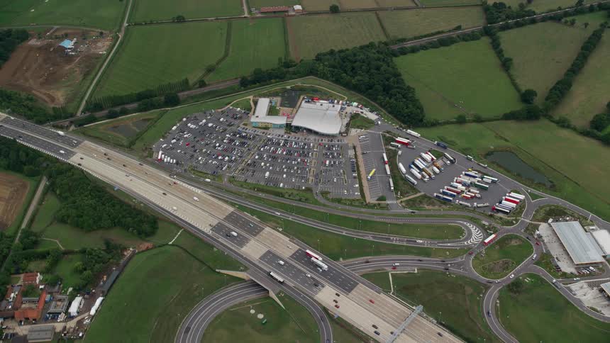 Aerial view ofa large parking lot filled with cars and trucks