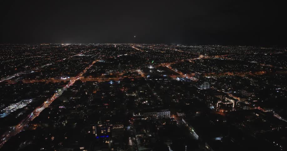 A large city at night being illuminated by residential lights