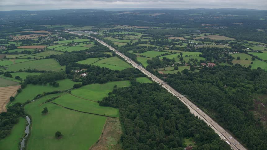 An aerial view intersection into multiple highway in a rural area