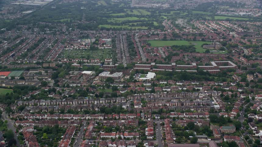 An aerial view of a city with a huge suburban neighborhood