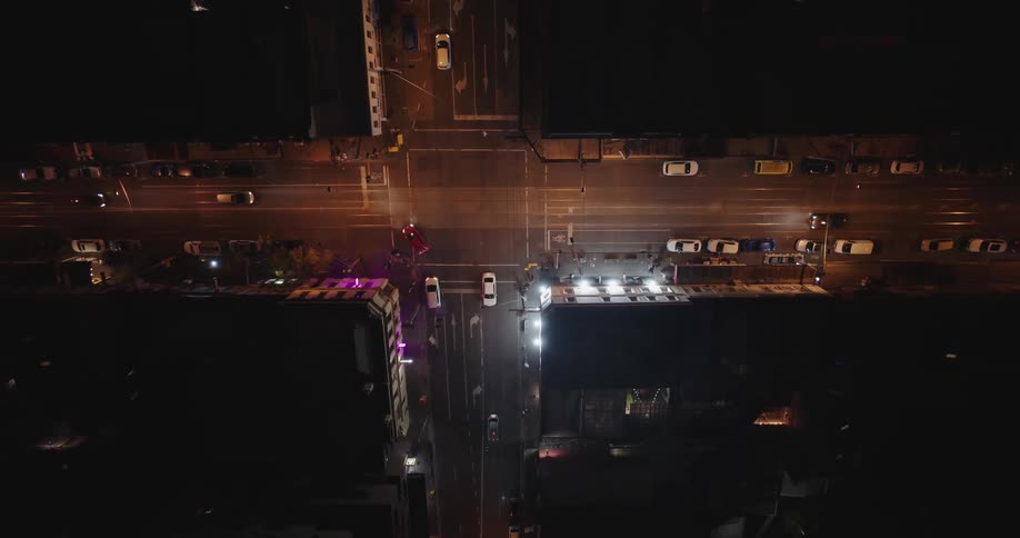 Aerial view of an intersection at night in the city