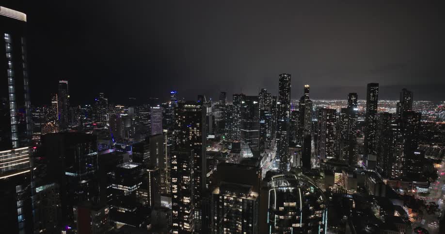 A metropolitan region with many tall buildings in one night