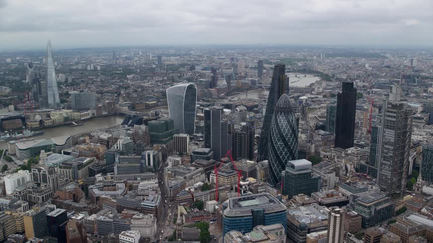 Aerial of a metropolitan city with glass towers and skyscrapers