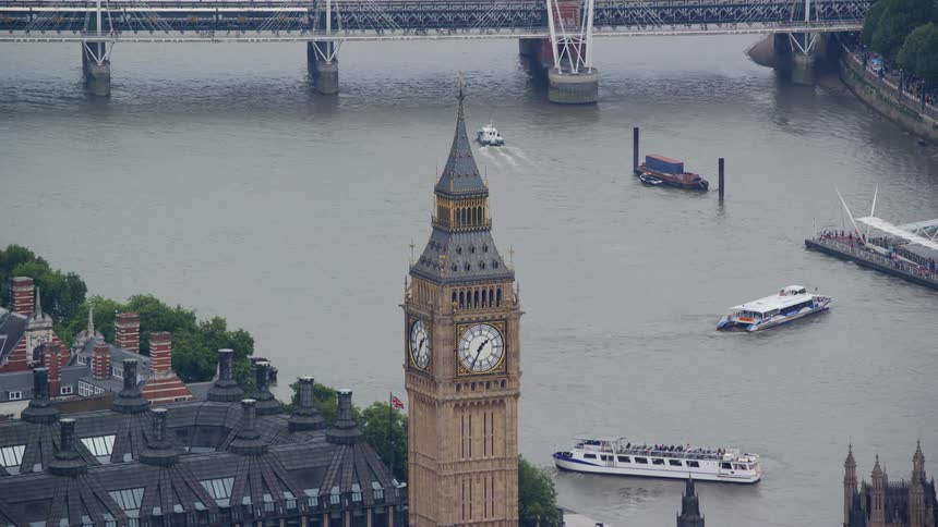 Aerial view of a clock tower by the seaside in a city